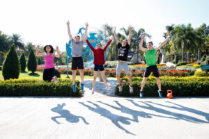 fitness retreat image of team jumping in air. Image taken in chiang mai thiland.