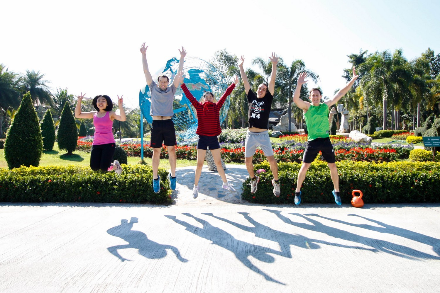 fitness retreat image of team jumping in air. Image taken in chiang mai thiland.